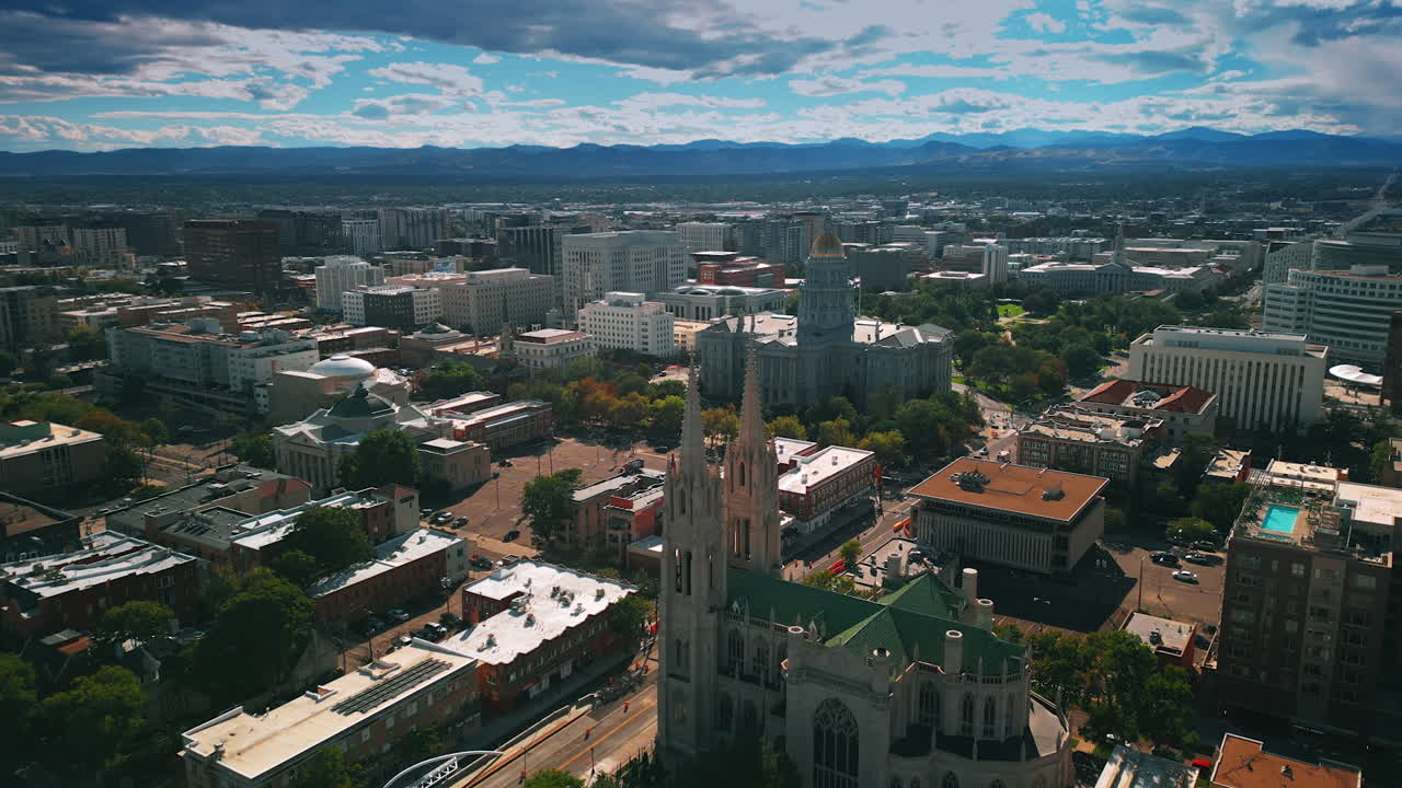 Gorgeous architecture of the Cathedral Basilica of Denver, Colorado, USA. Building of Colorado State Capitol further in the scenery. Aerial perspective