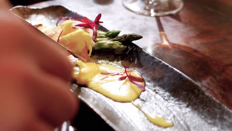 close-up of man eating healthy meal at restaurant