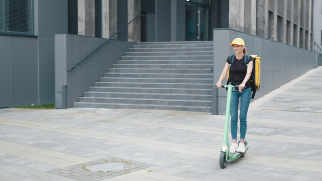 Woman on Electric Scooter Making Delivery