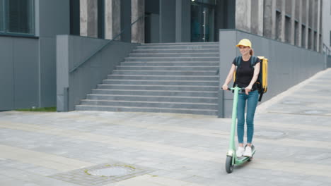 woman on electric scooter making delivery