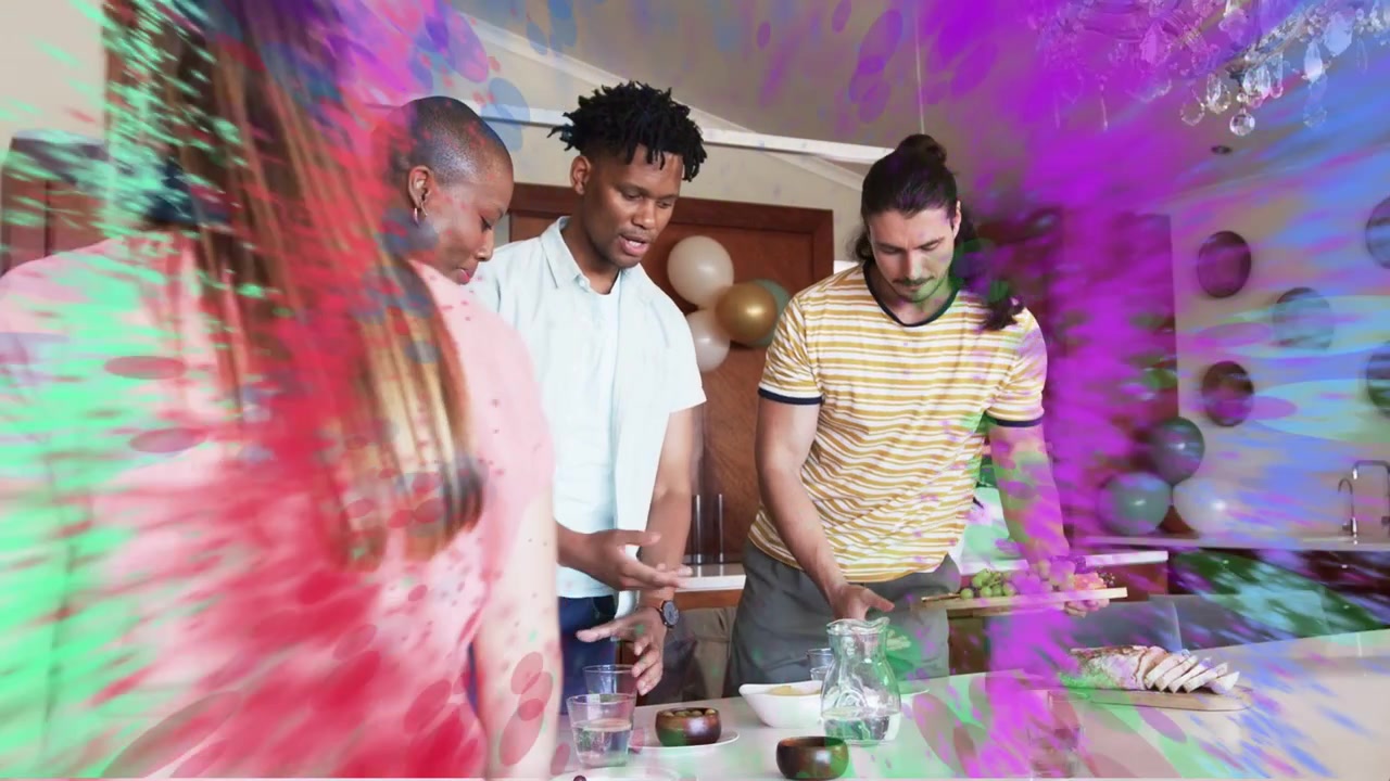Friends gathering at kitchen island as man reaching color swirl overlay pulsing, serving party food