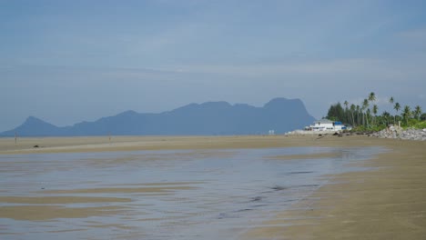 white sandy terombol beach background mount santubong,sarawak.