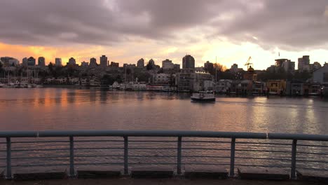 colorful evening sunset facing granville island boat homes