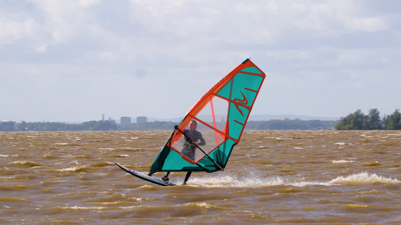 Windsurfer jumping in slow motion