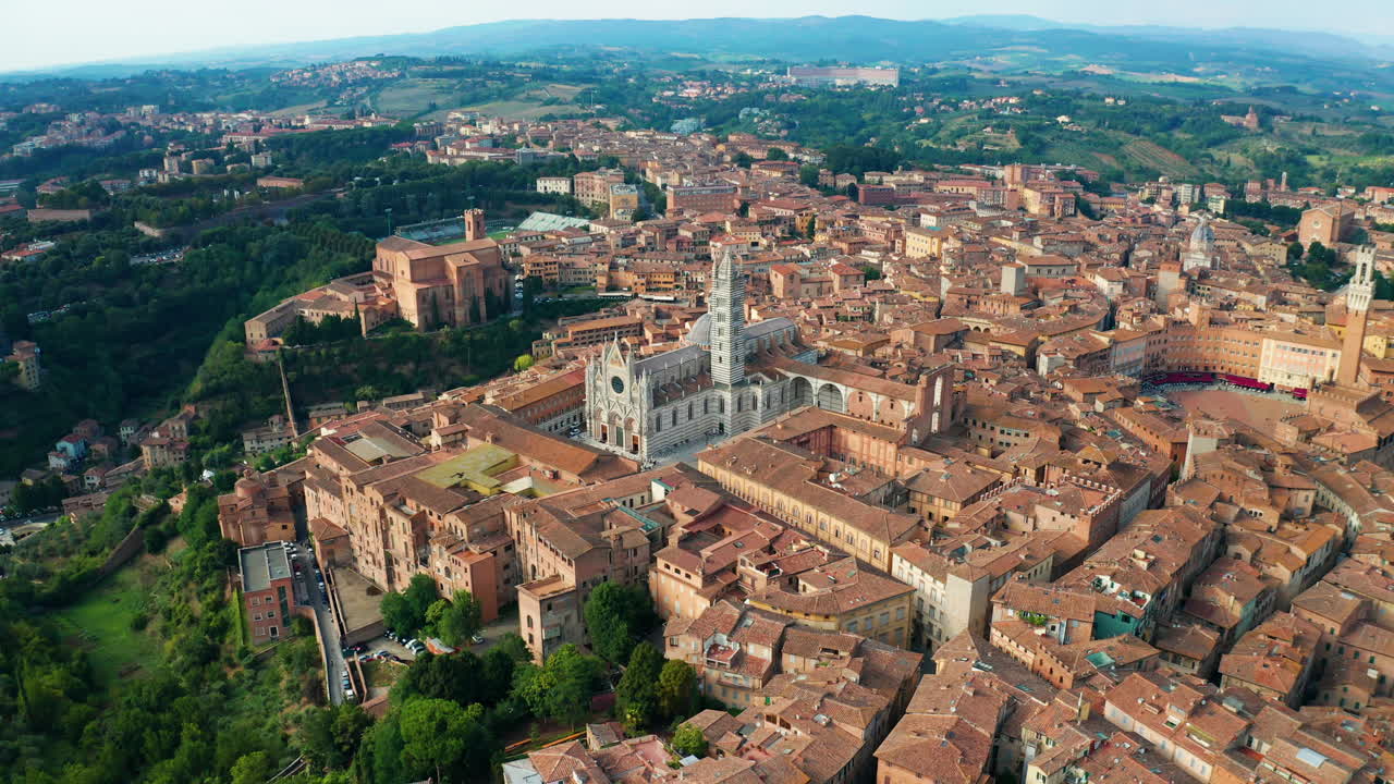 Aerial dolly out shot of the Torre del Mangia in Siena, Tuscany, Italy.