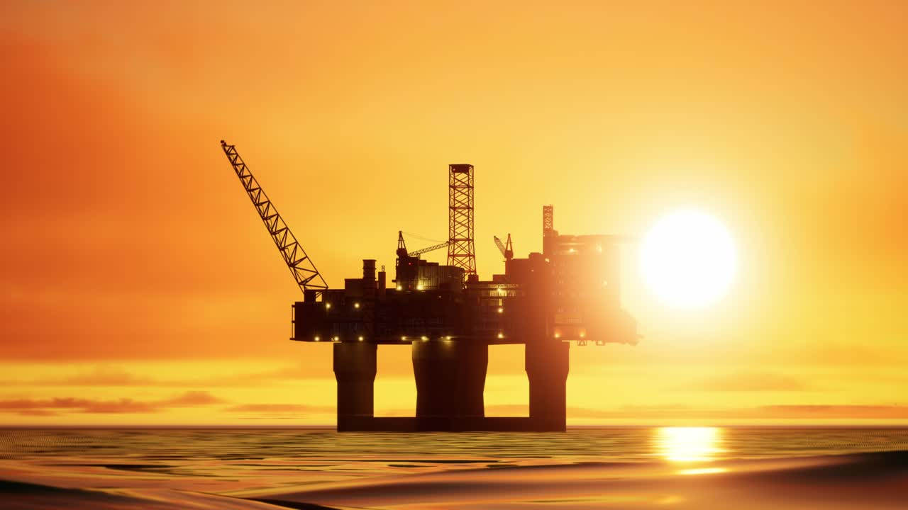 Aerial View Of Offshore Jack Up Drilling Rig During Sunset, Oil And Gas Industry