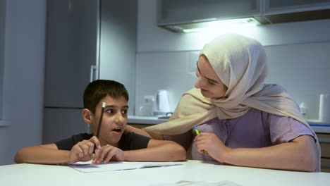 close-up view of mother and son in the kitchen