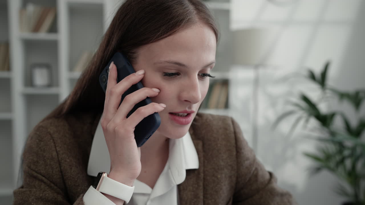 Woman on a Phone Call in an Office