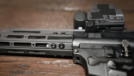 slow slide over a high-end ar style 9mm pistol called a personal protection weapon with holographic sight