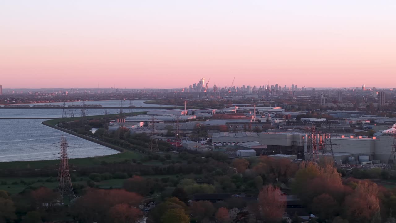 Enfield power station aerial view over industrial factory under purple sunset London skyline