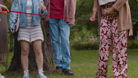 friends playing limbo outdoors