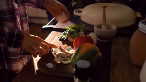 couple cooking food together in kitchen