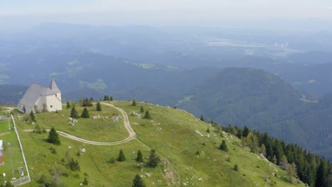 lonely peak urslja gora in slovenia with church st