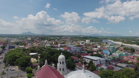 flying up over a basilica church tower, a landscape view of the city