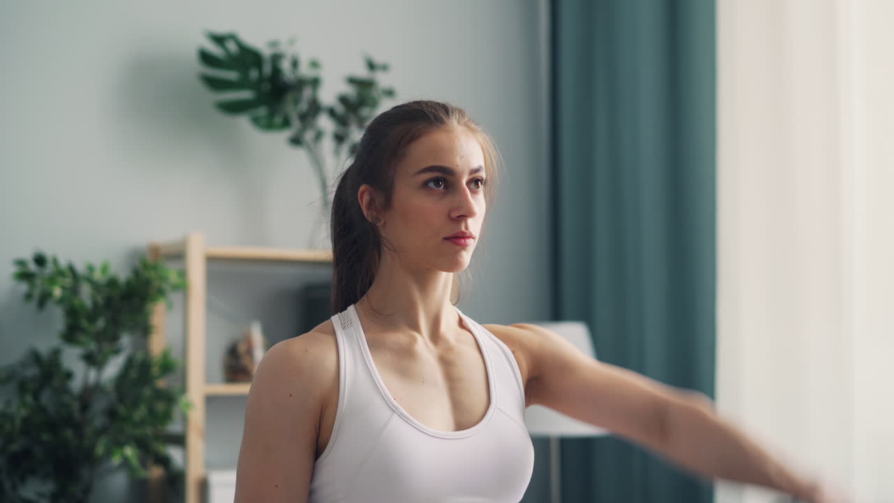 Woman Doing Home Workout with Dumbbells