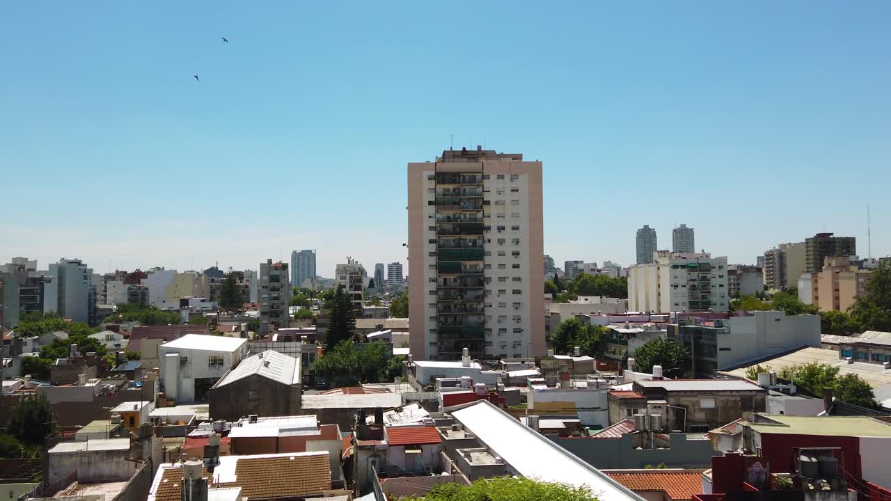 Aerial panning drone fly Buenos Aires City, Argentine Capital town, rooftops and neighborhood buildings