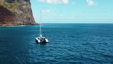 Gunboat-Catamaran-Sailboat-at-Anchor-off-Fatu-Hiva-Island-Marquesas-in-French-Polynesia-South-Pacific-Ocean