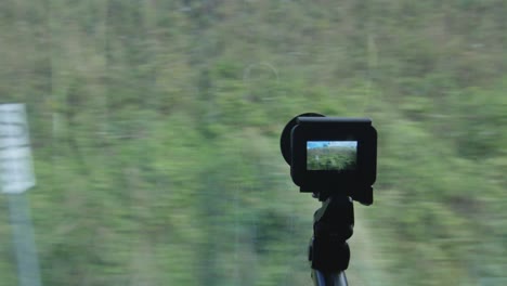 action camera through the window filming a train trip