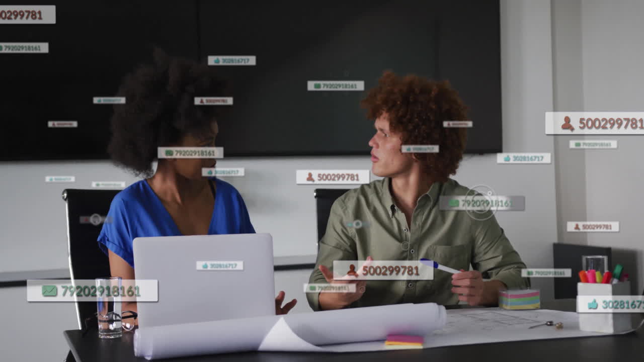 Two people discussing at office desk with floating numbers and data animation