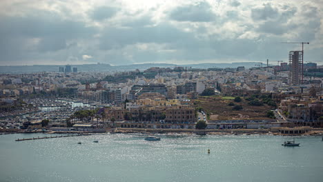 Overlooking-the-bustling-city-and-harbor-of-Valletta,-Malta---time-lapse