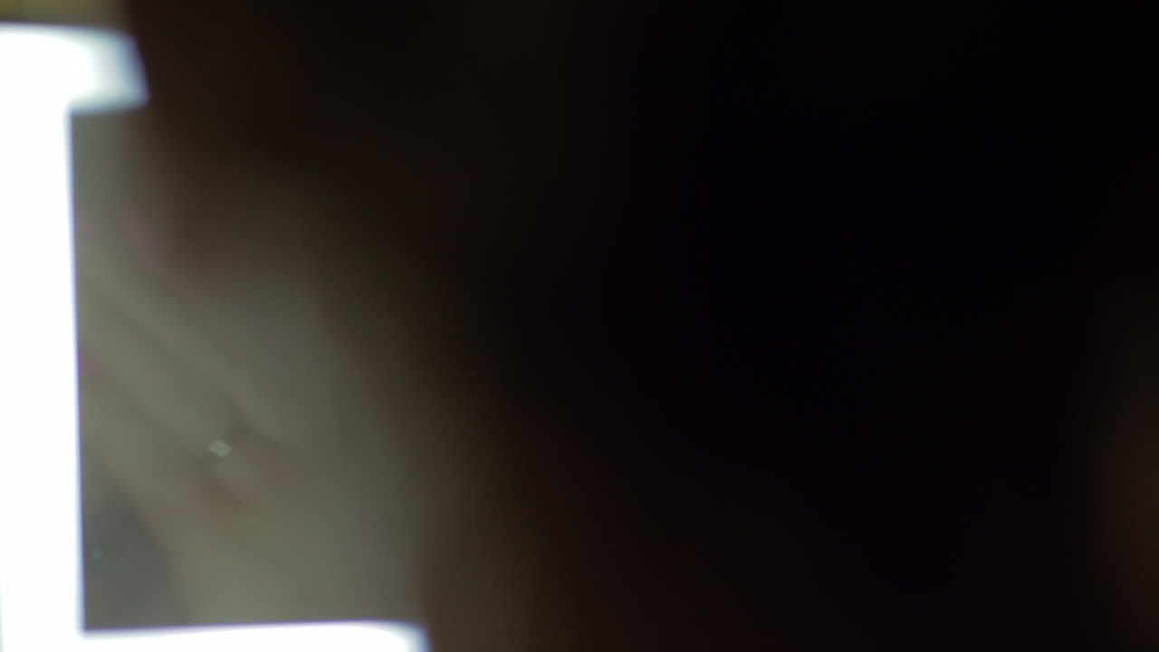 Woman applying night facial cream