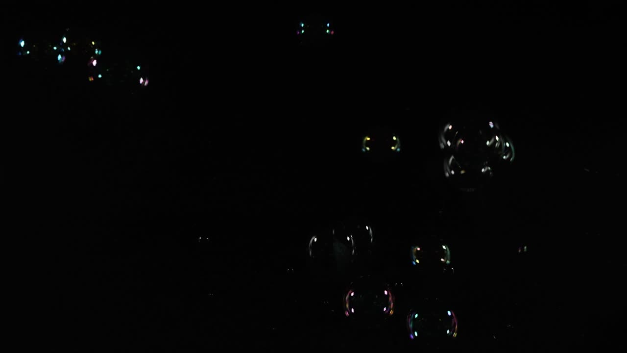 Floating bubbles illuminated by colorful light