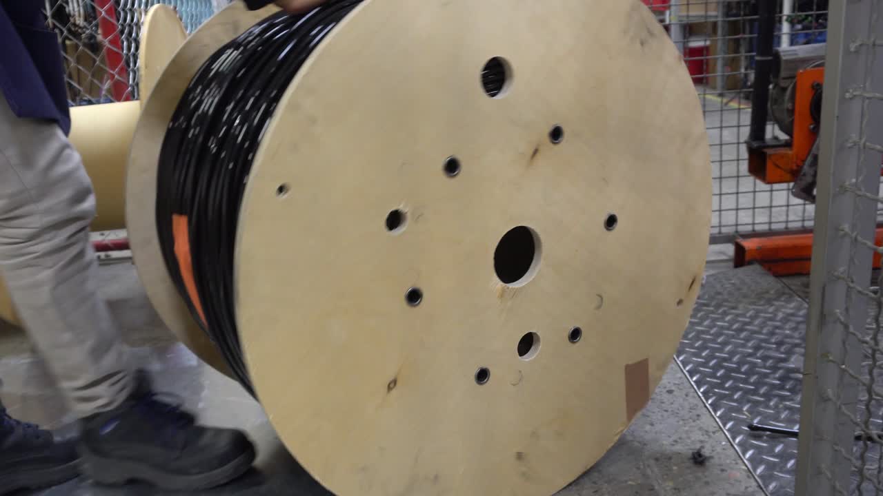 Close Up Pushing a Cable Roll