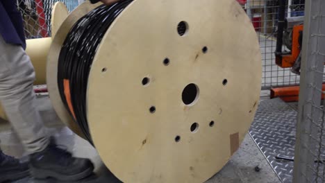 close up pushing a cable roll