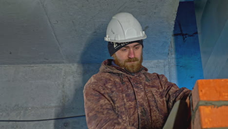 construction worker laying bricks