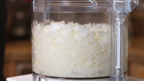 pulsing the food processor to produce perfectly chopped onions for a homemade recipe