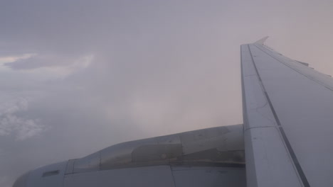 Plane-flying-through-the-clouds-view-from-inside