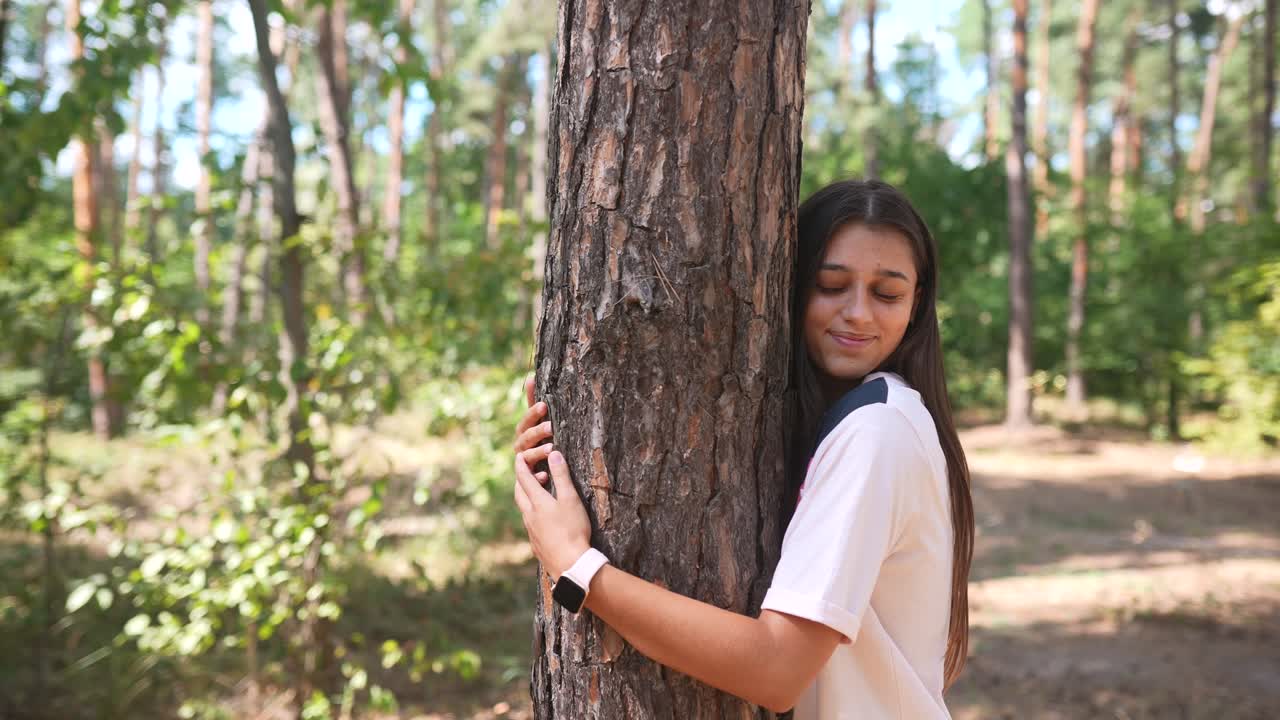 Girl Hugging a Tree in the Forest