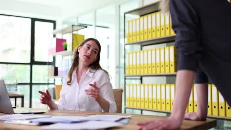 woman's expressive reactions during an office discussion