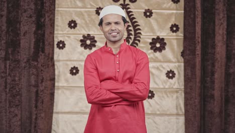 happy confident indian muslim man standing crossed hands