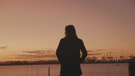 girl standing on hill as the sun la parouse sydney australia