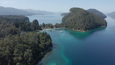 AERIAL---Nahuel-Huapi-Lake-in-Arrayanes-National-Park,-Villa-La-Angostura,-Neuquen,-Argentina,-lowering