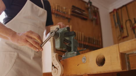 female luthier at work in her workshop