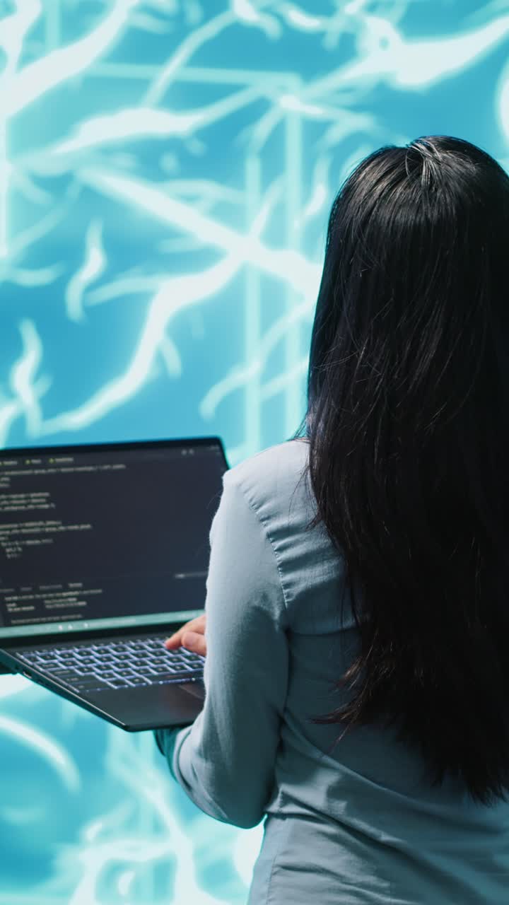 Vertical video Computer scientist working on laptop, programming artificial intelligence