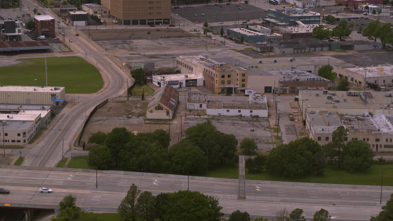 Drone reveal shot of downtown Tulsa, Oklahoma from nearby neighborhood
