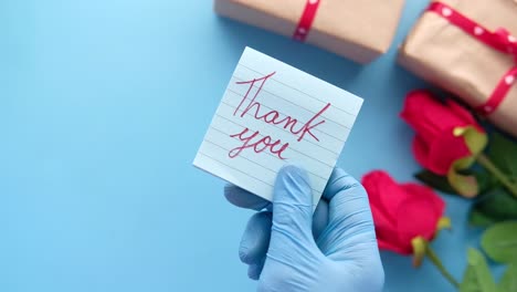 thank you note with gift and roses