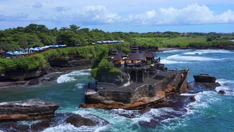 scenic landscape of tanah lot temple in bali, indonesia - aerial drone shot