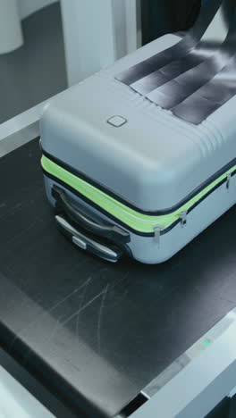 luggage being scanned at airport security