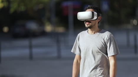 Young-man-using-VR-headset-on-street