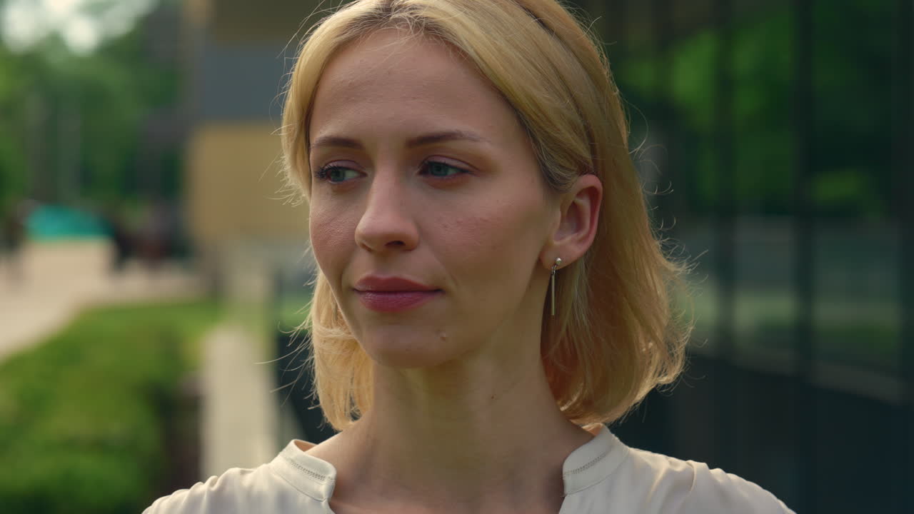 Portrait of a woman smiling outdoors