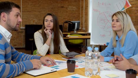 business team meeting involved diverse people participating in creative sustainable ideas steadicam shot across boardroom table shared work space