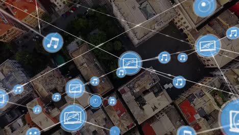 Animation-of-network-of-connections-with-icons-over-cityscape