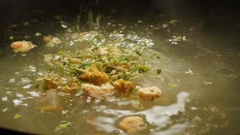 preparing a clear noodle soup