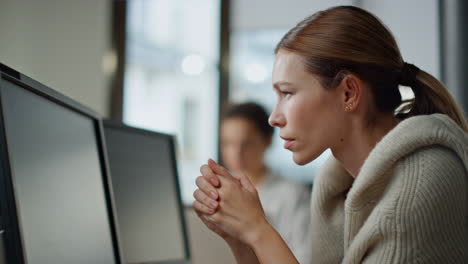 worried it manager analyze software code closeup. exhausted woman rubbing head