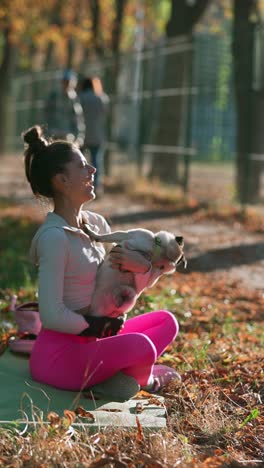 woman and pug in the park