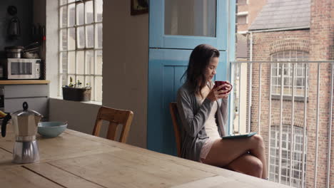 morning coffee for mixed race woman happy at home in pajamas